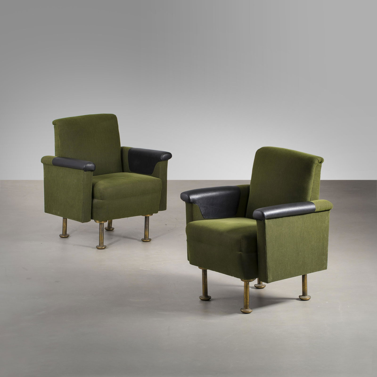 Alvar Aalto: A pair of chairs with their original dark green fabric, made for Stora Enso headquarters in Helsinki, designed by Alvar Aalto for ValaisintyÃ¶ . Fabric, leather, brass. Height 85cm, seat height 45cm