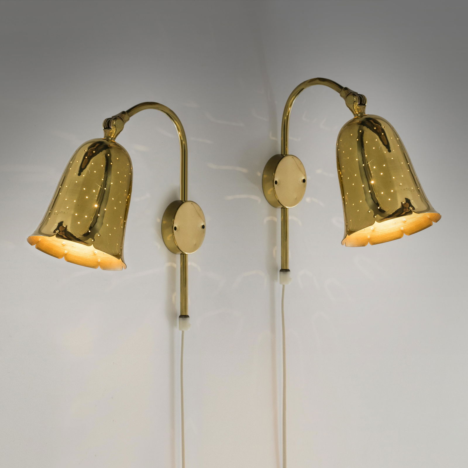 BorÃ©ns BorÃ¤s: A pair of perforated brass wall sconces in a corolla shape from the 60's, made by BorÃ¨ns BorÃ¤s, , Shade height = 16cm, Not signed