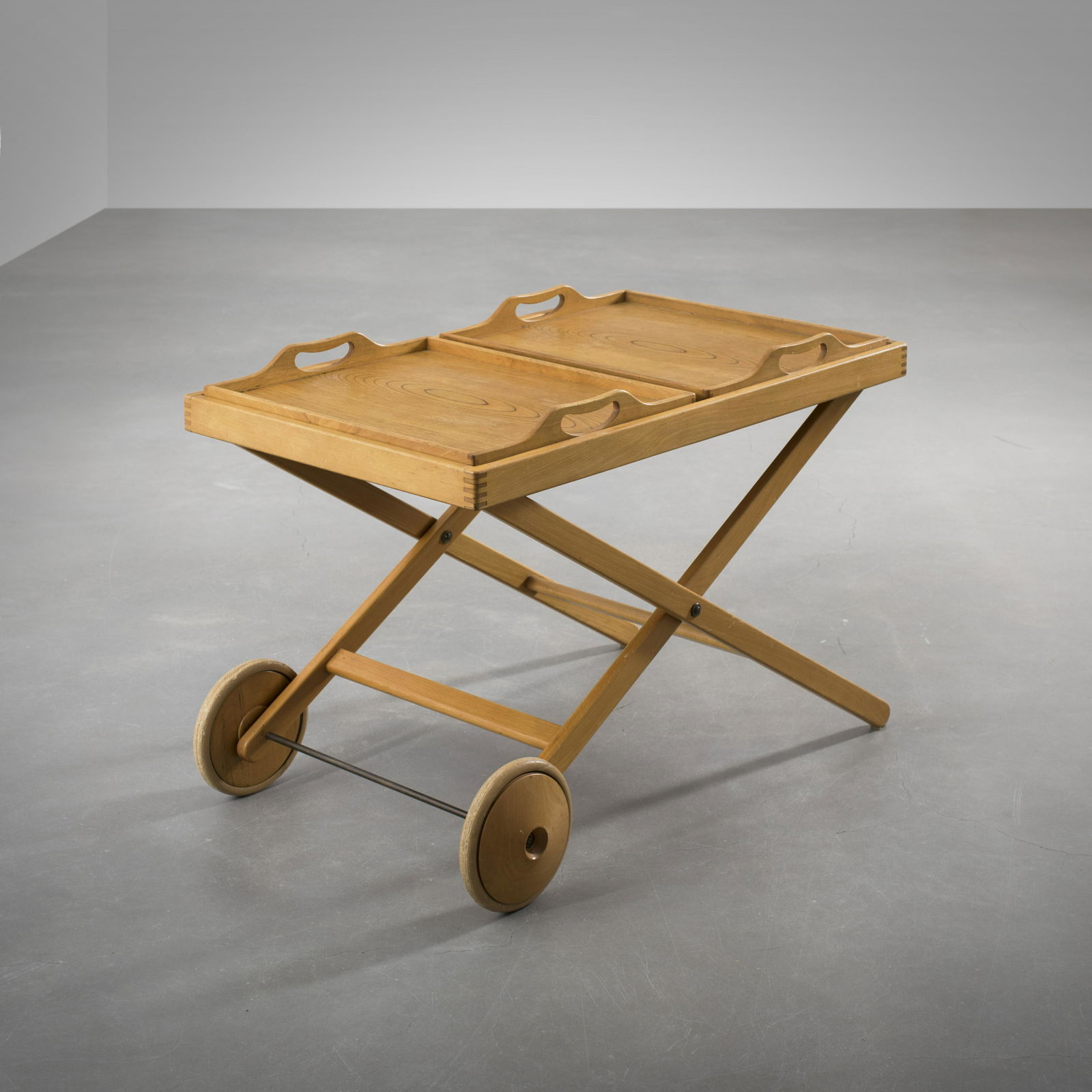 Tapio Wirkkala and Aulis Leinonen: A tea trolley with two removable trays on an X structure, designed by Tapio Wirkkala and Aulis Leinonen for Asko in the 50's, Birch, Height = 60cm, length = 90cm, Not signed