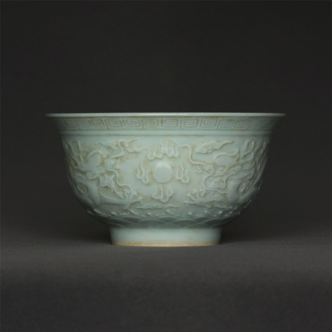 White porcelain Carved dragon bowl of Ming Dynasty: White porcelain Carved dragon bowl of Ming Dynasty XuanDe mark. Measure(inch), Height: 2-5/8, Diameter: 4-7/8 .
