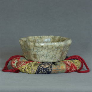 A Chinese Ge-Kiln Porcelain Brush Washer Southern Song: A Chinese Ge-Kiln Porcelain Brush Washer Southern Song Dynasty. With Japanese silk pouch. Brush Washer Measure(inch), Height: 1-1/2 , Diameter: 3-5/8. Provenance: Estate Consignment of Japanese tea ce