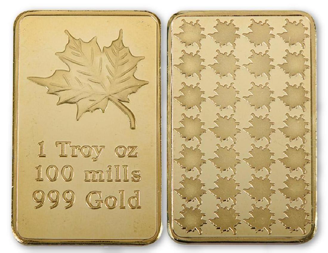 Canada Maple Leaf 999 Gold Clad Bullion Bar: Canada Maple Leaf 999 24K Gold Clad Bullion Bar. Unique design. Size: 4.4cmx2.8cm. Weight ? 28 grams.