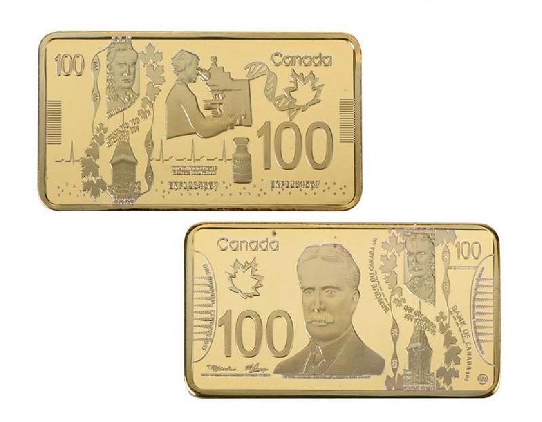 Canada 100 Dollars Gold Clad Bar: Non-currency bar. Size: 50mm x 28mm. Weight: about 31g