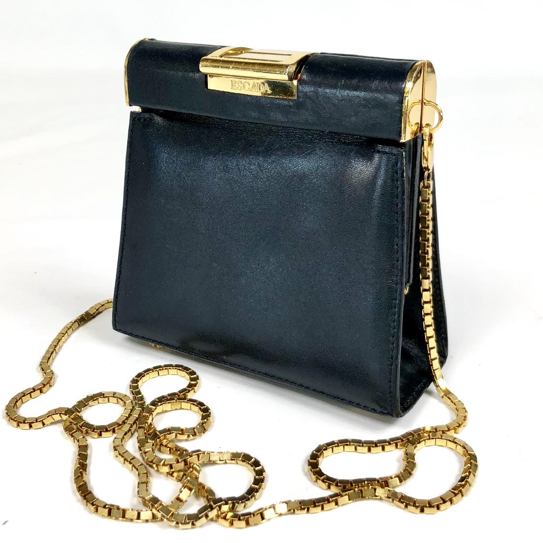 Vintage Escada Hand Purse: Vintage black Escada leather hand purse in very good condition. Measures 5.25â€w x 4.75â€h x 1.75â€d.