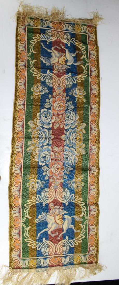 Handmade Horse Table Cloth w/ Matching Table Runner: This is a matching tablecloth and runner that was made in Morocco, Italy. The main colors are yellow, red, green, blue and white. The design on both are of horses with people on them. With floral desi