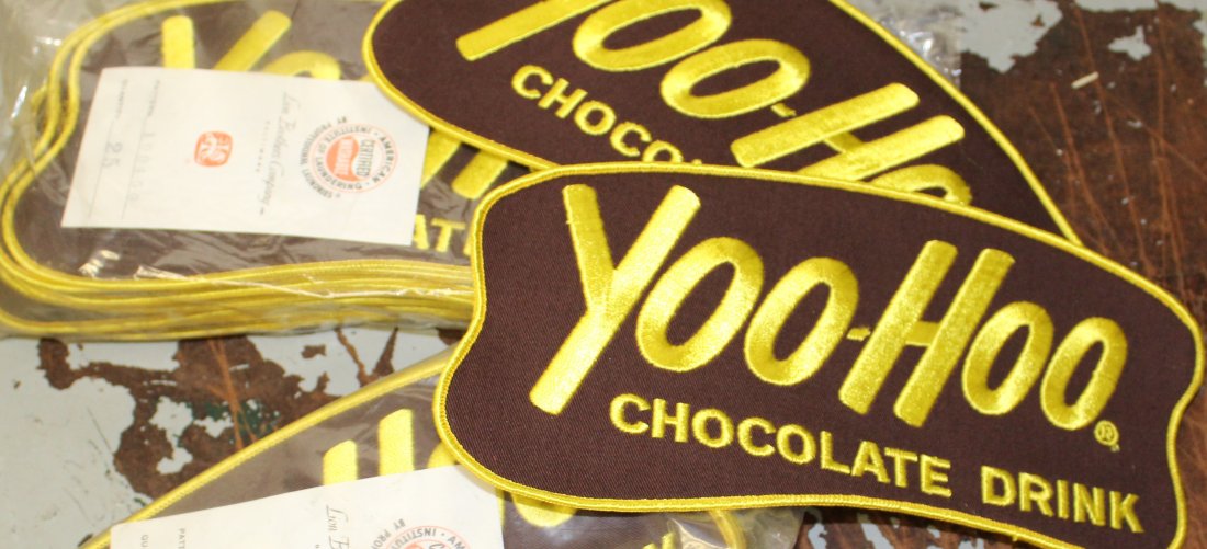 2 unopen packs Yoo-Hoo jacket patches from the 60s 70s: these are in great condition old new stock from the 70s and 60s they where the delivery men patches for the back of there jackets the size is 9.50 ins long by 5 ins wide nice lot
