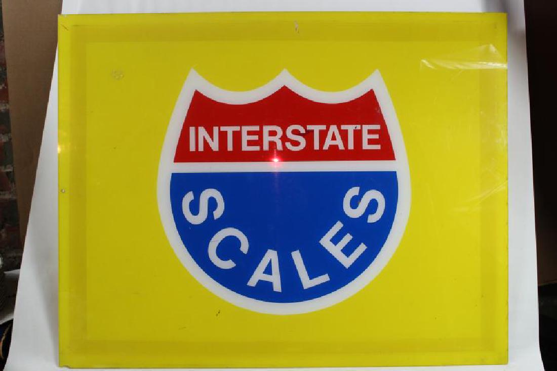 Yellow interstate scales sign: Yellow interstate sign with White, blue and red on it; Measurments: 30x24