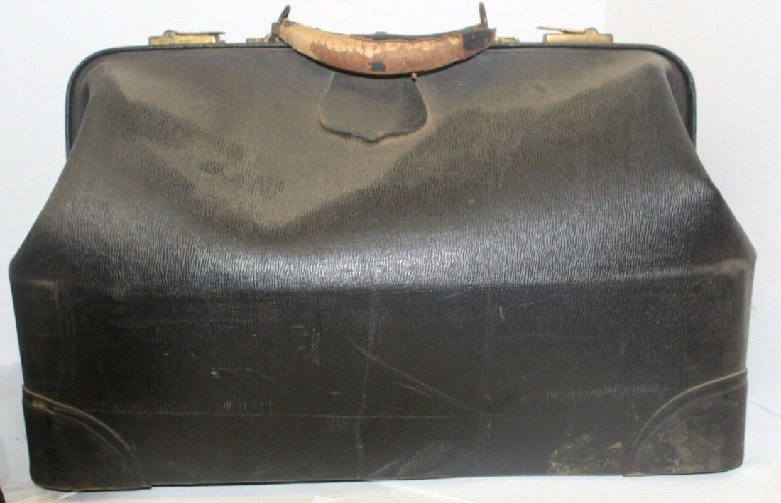 Antique Leather Doctors Medical House Call Bag: This item is an Antique Leather Doctors Medical House Call Bag. This is a cool antique doctors bag, that is made from Naugahyde, the no inside is there but not visible. It is in okay condition, it doe