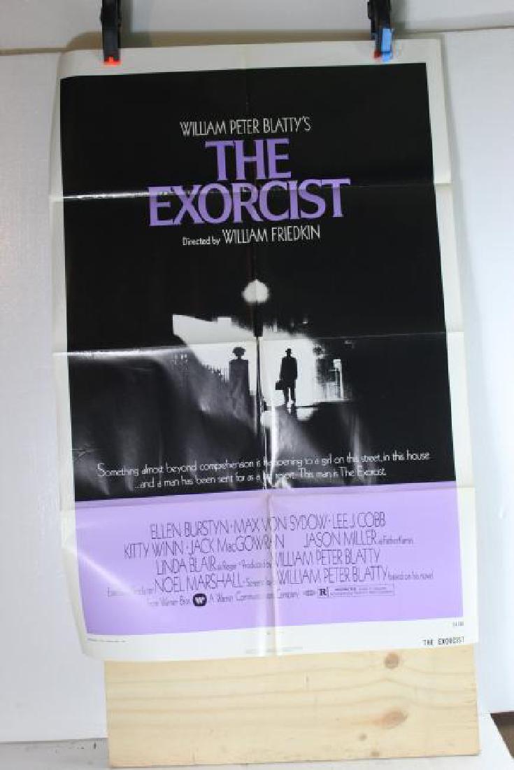 The Exorcist (1974) Warner Bros inc 74/40: Original poster from the 1974 film â€œThe Exorcist”. The poster is black and light purple with purple writing on the lack section. *All posters shipped folded as shown in 2nd phot