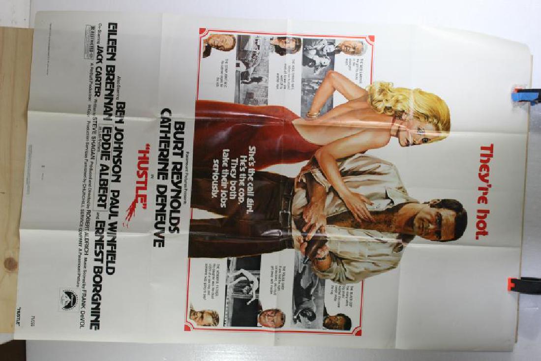 Hustle (1975) Paramount Pictures 75/265: Original poster from the 1975 film â€œHustle” starring Ben Johnson, Paul Winfield, Eileen Brennan and Ernest Borgnine. Poster is white with a large man and woman on top and around