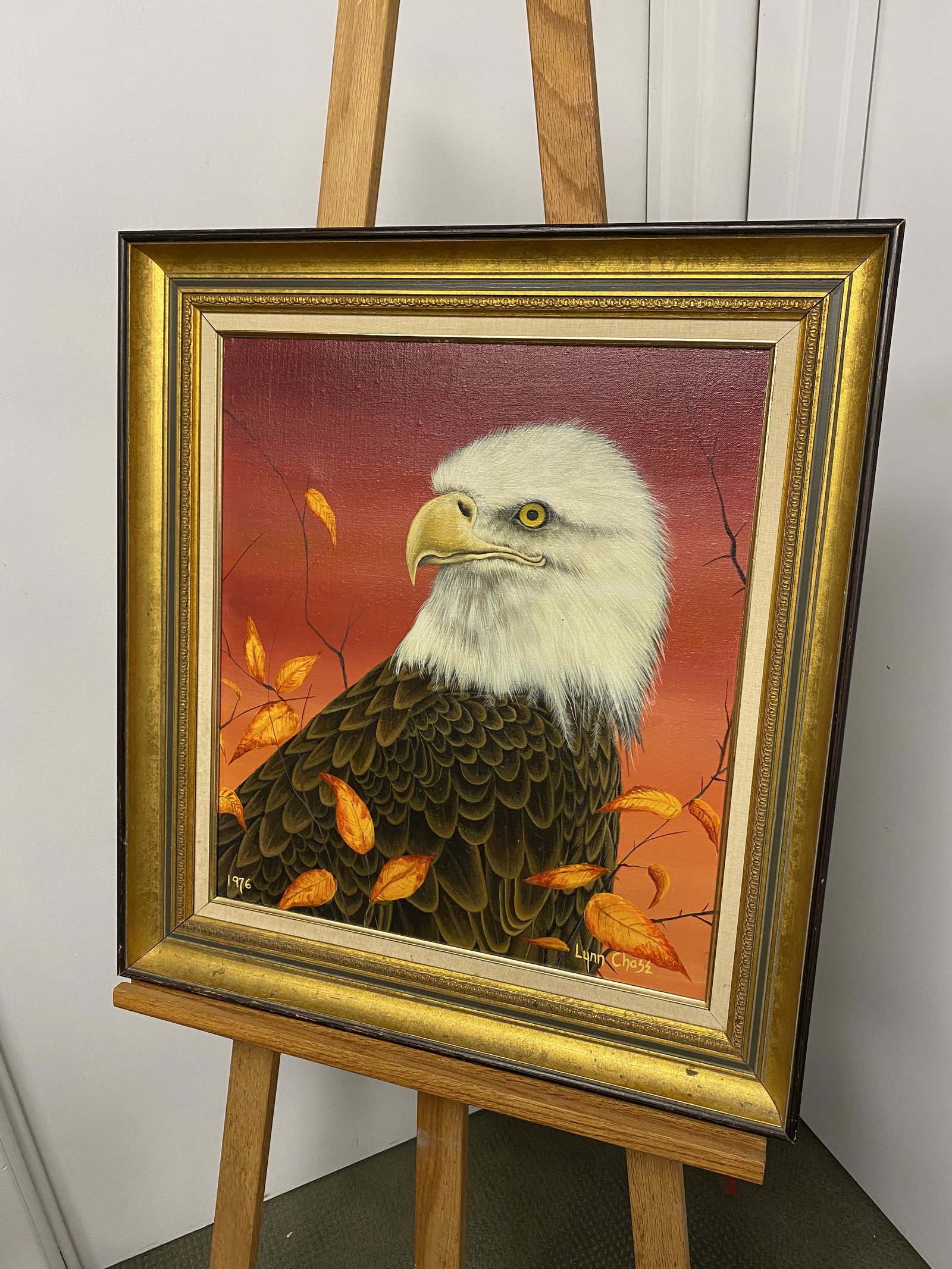 Bald Eagle in the Fall Oil on Canvas by Lynn Chase: This is a nice piece of art work by Lynn Chase, it is a beautiful piece of work , she used red and orange to bring out the the colors of the bald eagle. It measures 23" L x 25"H.