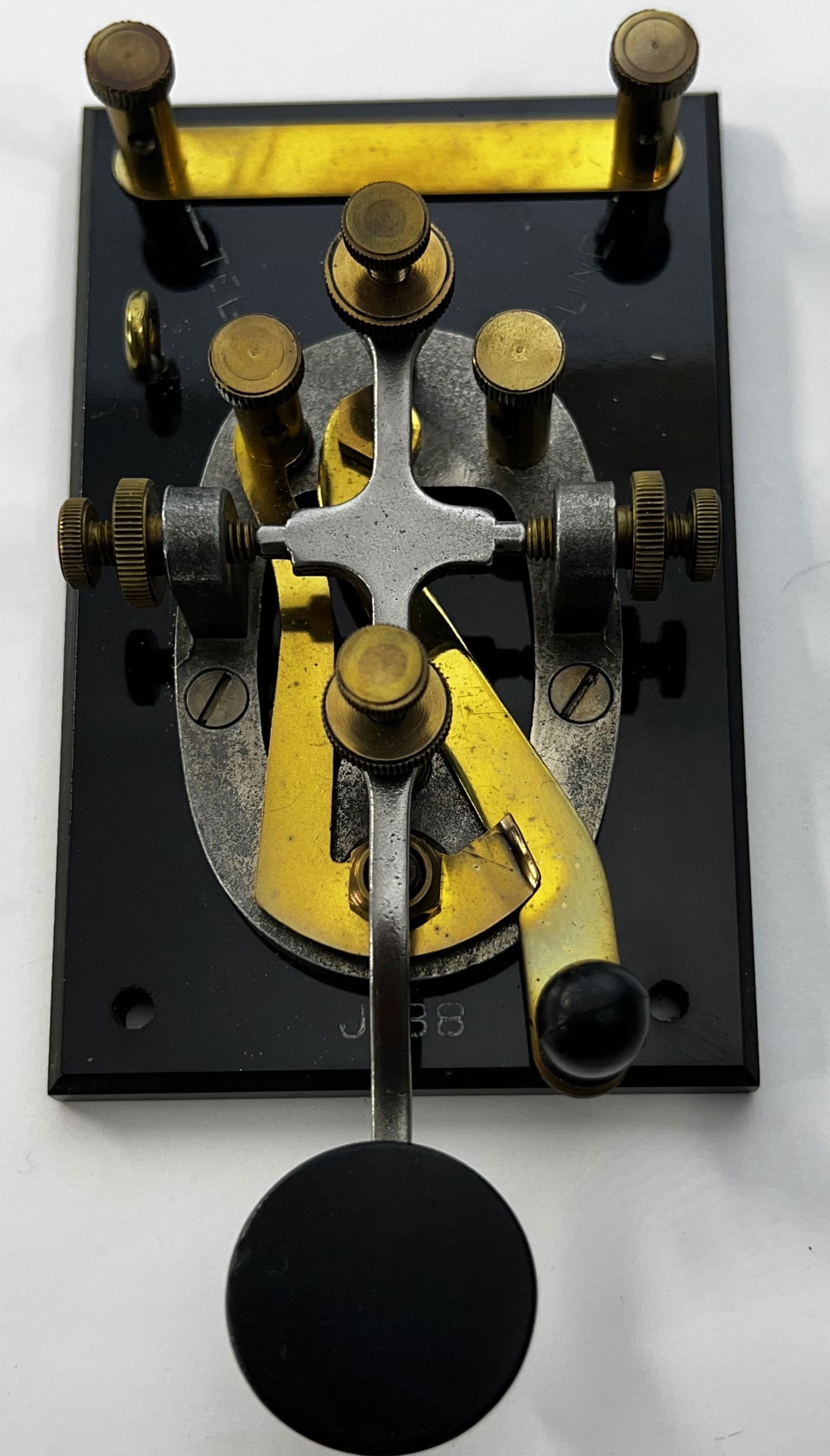 Vintage Morse Code Telegraph Key J 38: Vintage Morse Code Telegraph Key J 38 Military Style WWII Era. Has written on it J38 and on one side Line and the other side Tel. It is in working condition. It measures 6 1/2 inches length 3 inches w
