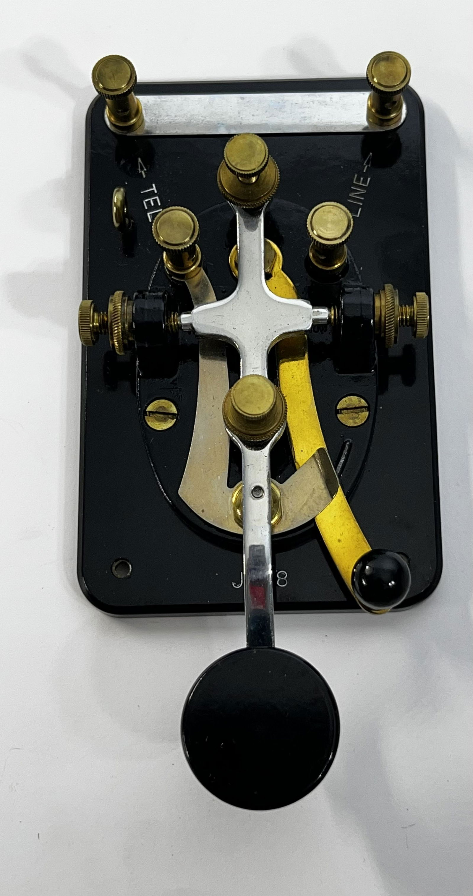 Vintage Morse Code Telegraph Key J 38: Vintage Morse Code Telegraph Key J 38 Military Style WWII Era. Has written on it J38 and on one side Line and the other side Tel. It is in working condition. It measures 6 1/2 inches length 3 inches w
