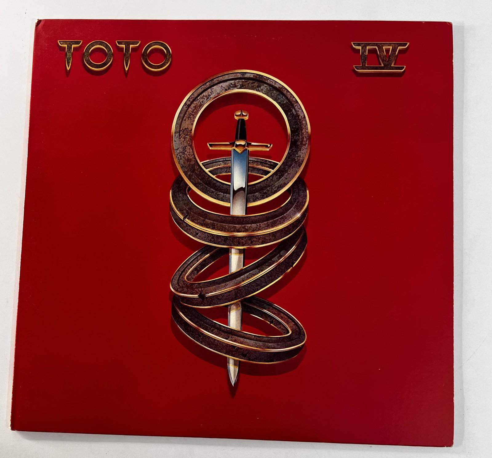 1982 TOTO IV Vinyl Album: 1982 TOTO IV Vinyl Album. It measures 12". We looked at this vinyl and it is in excellent used condition. Side 1 Serial No. AL-37728 Side 2 Serial No. PBL-37728