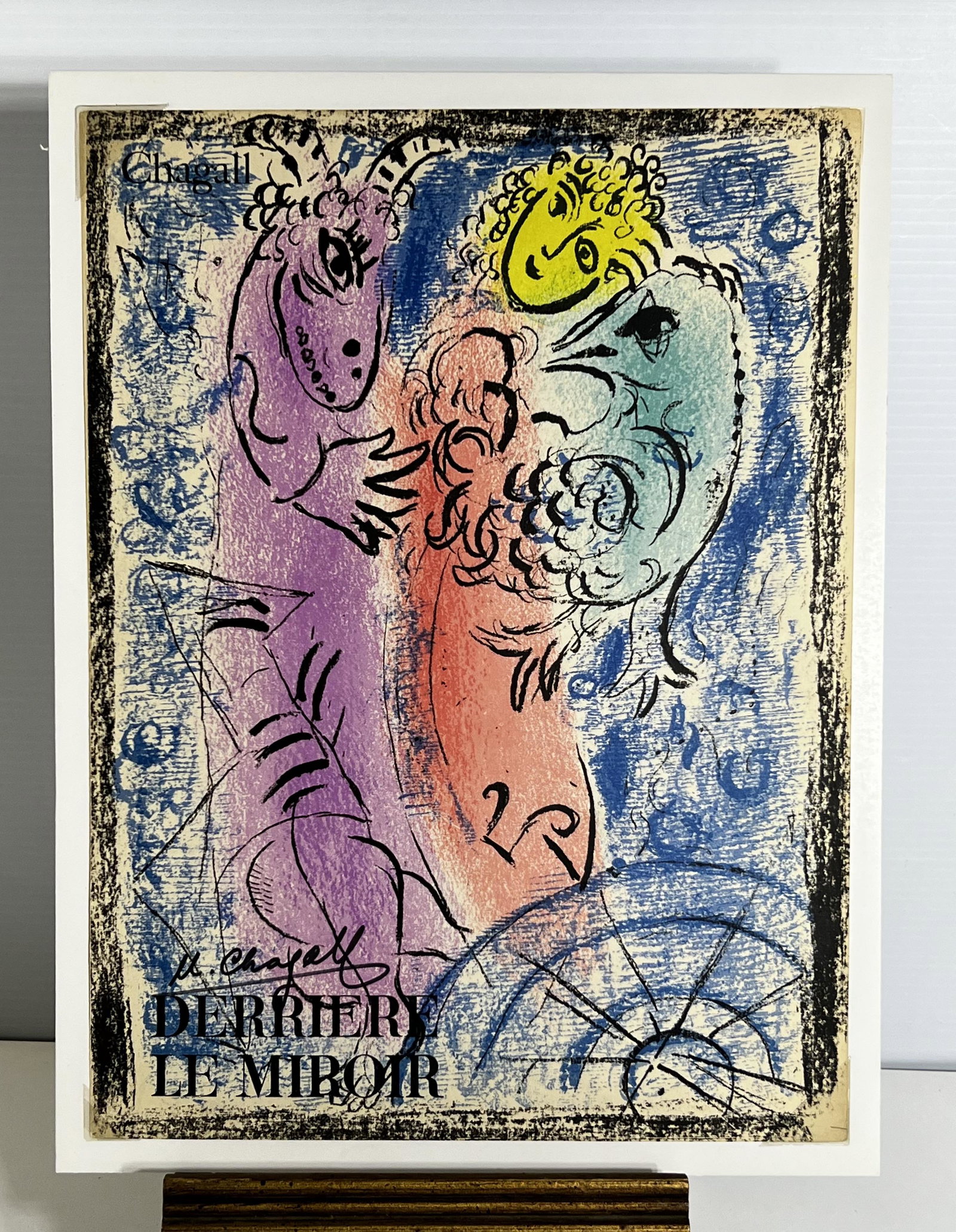 Marc Chagell Lithograph Derriere Le Miroir No 132 1st Edition 1962: Marc Chagell Lithograph Derriere Le Miroir No 132 1st Edition 1962. This is a beautiful lithograph of what looks like some sort of monster going after a women. On the back of he lithograph It has Aime