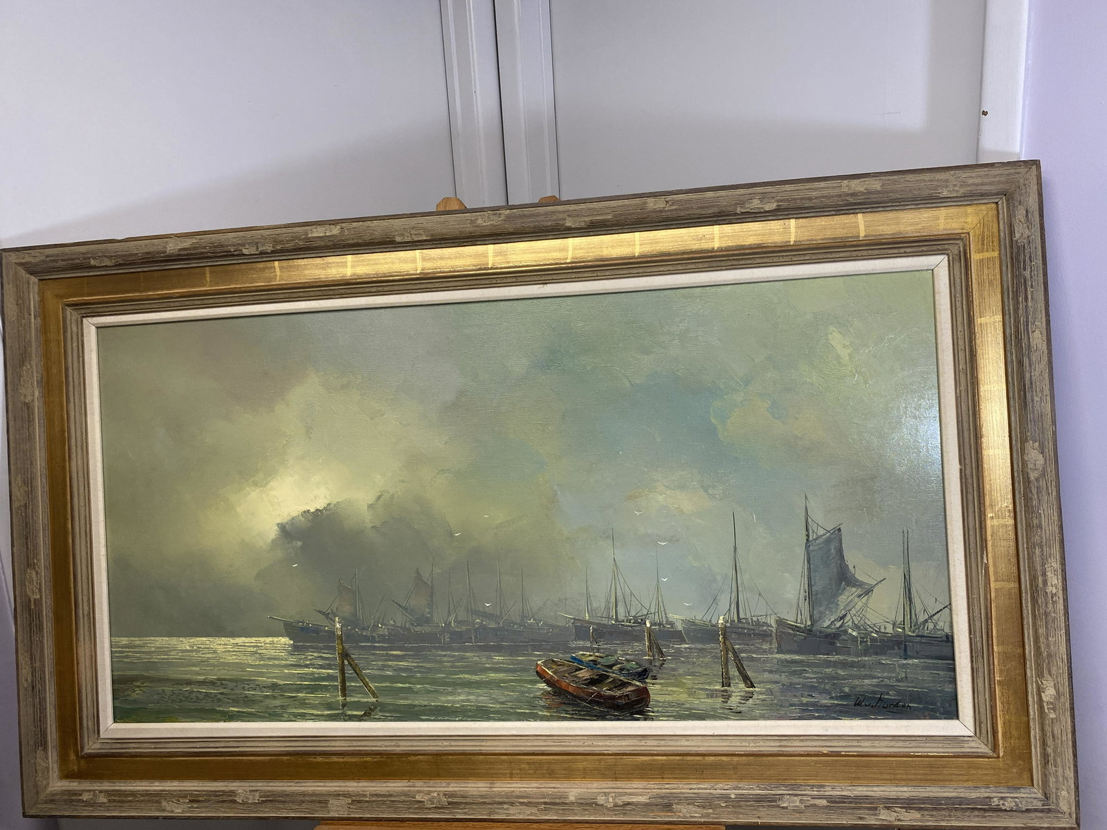 Ships Docked on the Ocen Front by W.w. Horden: This is a nice piece of artwork by W.w. Horden. it is in good condition, the painting is of Ships Docked on the Ocen Front on a cloudy day, the artist gave this painting a very eerie feel. It measures