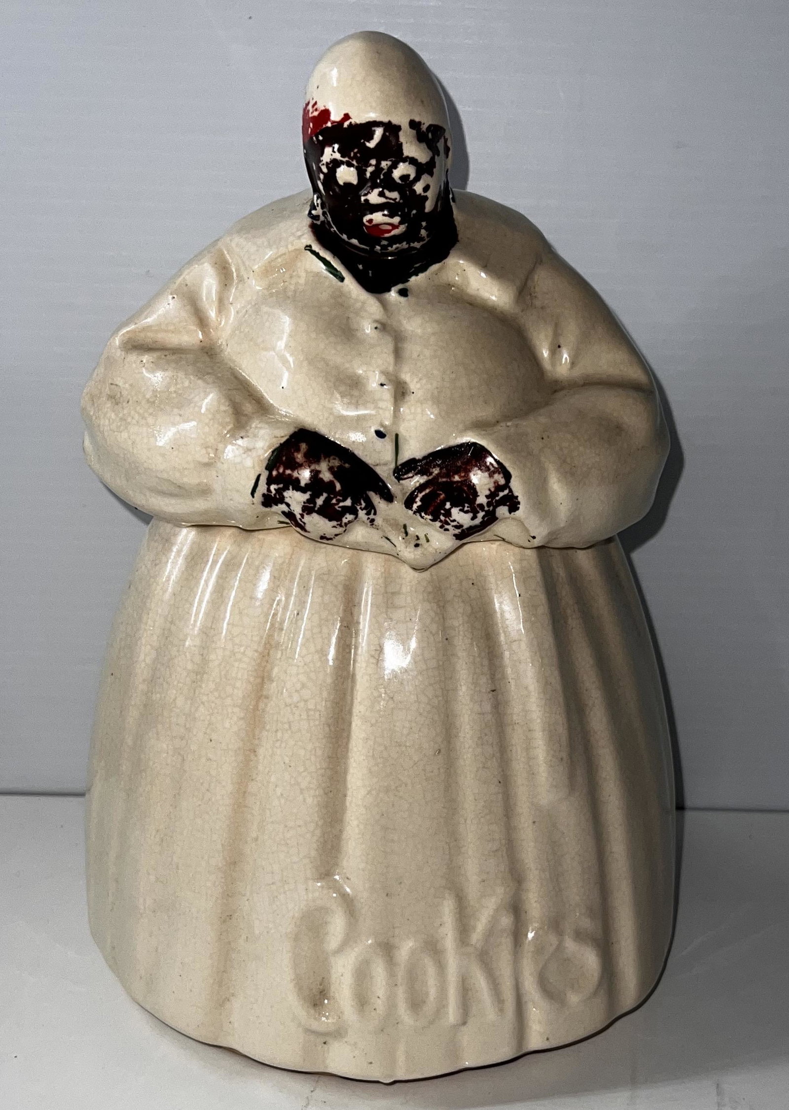 McCoy Pottery "Mammy" Black Americana Cookie Jar: McCoy Pottery "Mammy" Black Americana Cookie Jar. Made by the Nelson McCoy Pottery Co. of Roseville, Ohio. The company reportedly started making figural cookie jars circa 1940, but introduced its "Mam