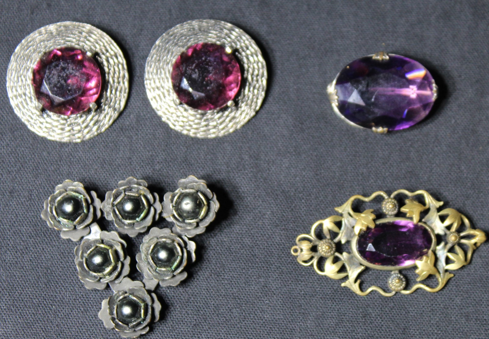 (4) Brooches / Earrings - Costume Jewelry: Kofin, & Jos Weinstein N.Y.C: (4) Brooches / Earrings - Costume Jewelry. This is a beautiful lot of costume jewlery, all piece are in good condition. There are 2 brooches one is a beautiful circular amethyst color stone 1.25" x 1"