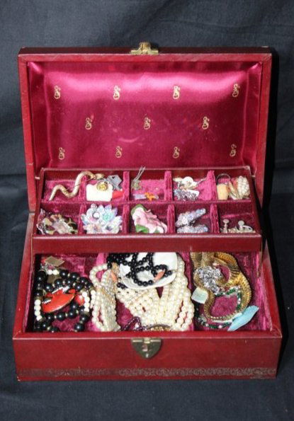 Beautiful Red Mahogany Colored Jewelry Box w/ Mixed Pieces of Costume Jewelry: Trifari, Cora, 1928: Beautiful Red Mahogany Colored Jewelry Box w/ Mixed Pieces of Costume Jewelry.This lot contains Various pieces like Braceelts, Earrings, Necklaces, Brooches, Pins and pendants. The lot includes variou