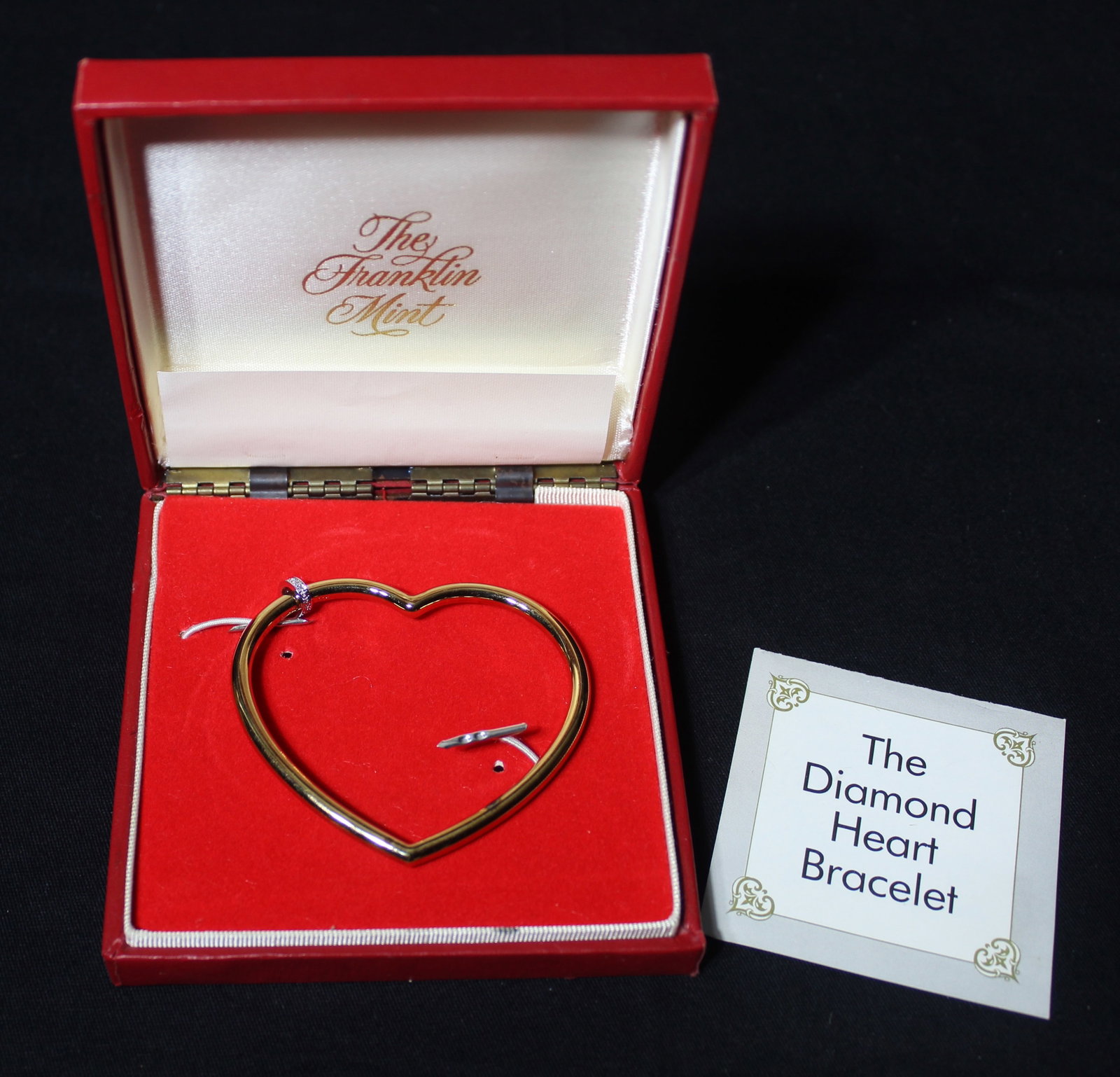 The Franklin Mint The Diamond Heart Bracelet 26 grams: The Franklin Mint The Diamond Heart Bracelet. This is a beautiful piece of jewelry. The bracelet was crafted from soild sterling silver, electroplated with 22 karal god and set with 6 full-cut diamond