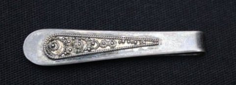 5 Grams 925 Sterling Tie Clip: 5 Grams 925 Sterling Tie Clip. It has a very unique design on it of small circles on a smaller size of the tie clip. Written on the back it says. Sterling Silver Jerusalem Israel Hand Made. It is in v