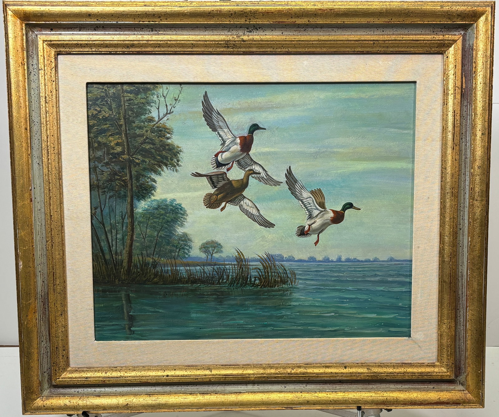 Mallard Ducks in Flight Painting Oil on Canvas by Adolfo Tagliaferri: Mallard Ducks in Flight Painting Oil on Canvas. This is a beautiful painting, the artist caotures the dynamic beauty of a group of mallard ducks in mid flgiht. The painting was produced by a skillful 