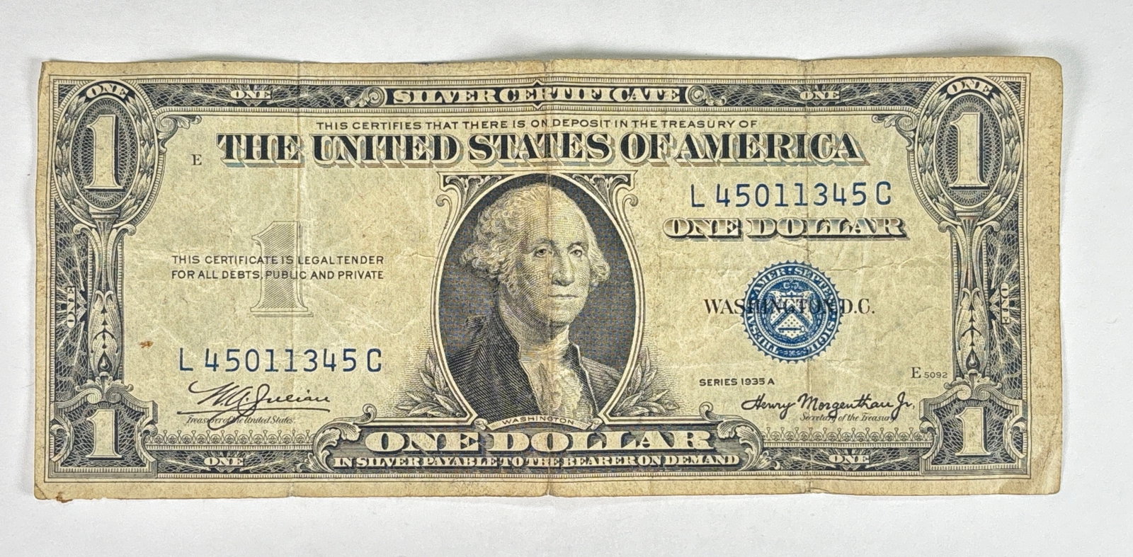 1935 A $1 Bill S/N L45011345C - Silver Certificate Blue Sheild: 1935 A $1 Bill S/N L45011345C, featuring a Silver Certificate Blue Sheild. This is a remarkable piece of american history. The bill does look old, but still in gresat condition for its age.