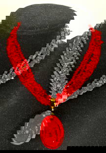 Vintage Bright Red Natural Coral Strung Necklace.: This is a vibrant necklace that showcases the captivating beauty of red coral. Each bead is unique in its texture and hue, a fiery bright red that is enhanced by gold tone accents, which help to add