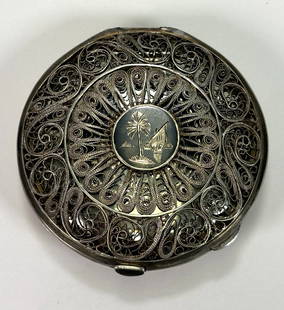 Antique Iraqi Solid Silver Filigree Niello Ladies Compact Case: This is an exquisite piece. The case features an intricate filigree work and niello detailing. It is a beautiful example of antique craftsman. It is a perfect collectors piece, great for someone who a