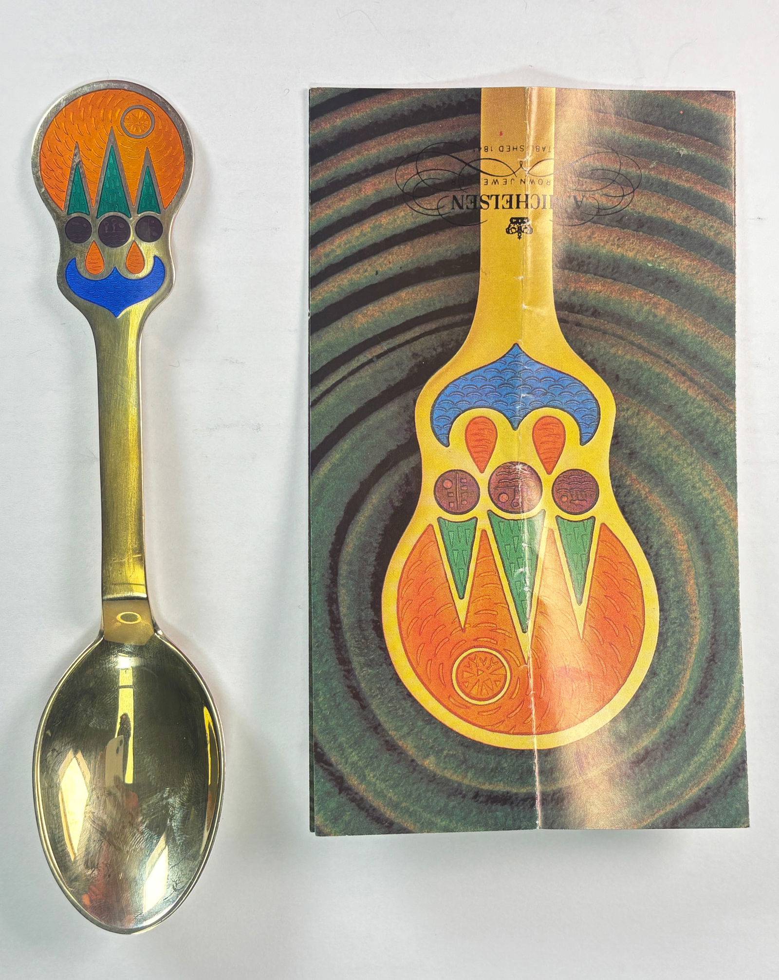 A. Michelsen Christmas Spoon: The Sun Kingdom - Lars Akirke - 1979- 24kt Gold Plated over 925 SS: A. Michelsen Christmas Spoon - The Sun Kingdom - Lars Akirke - 1979. A beautiful 24kt Gold Plate over 925 Sterling silver spoon with beautiful enamel design tat depicts a sunny scenery. It captures th