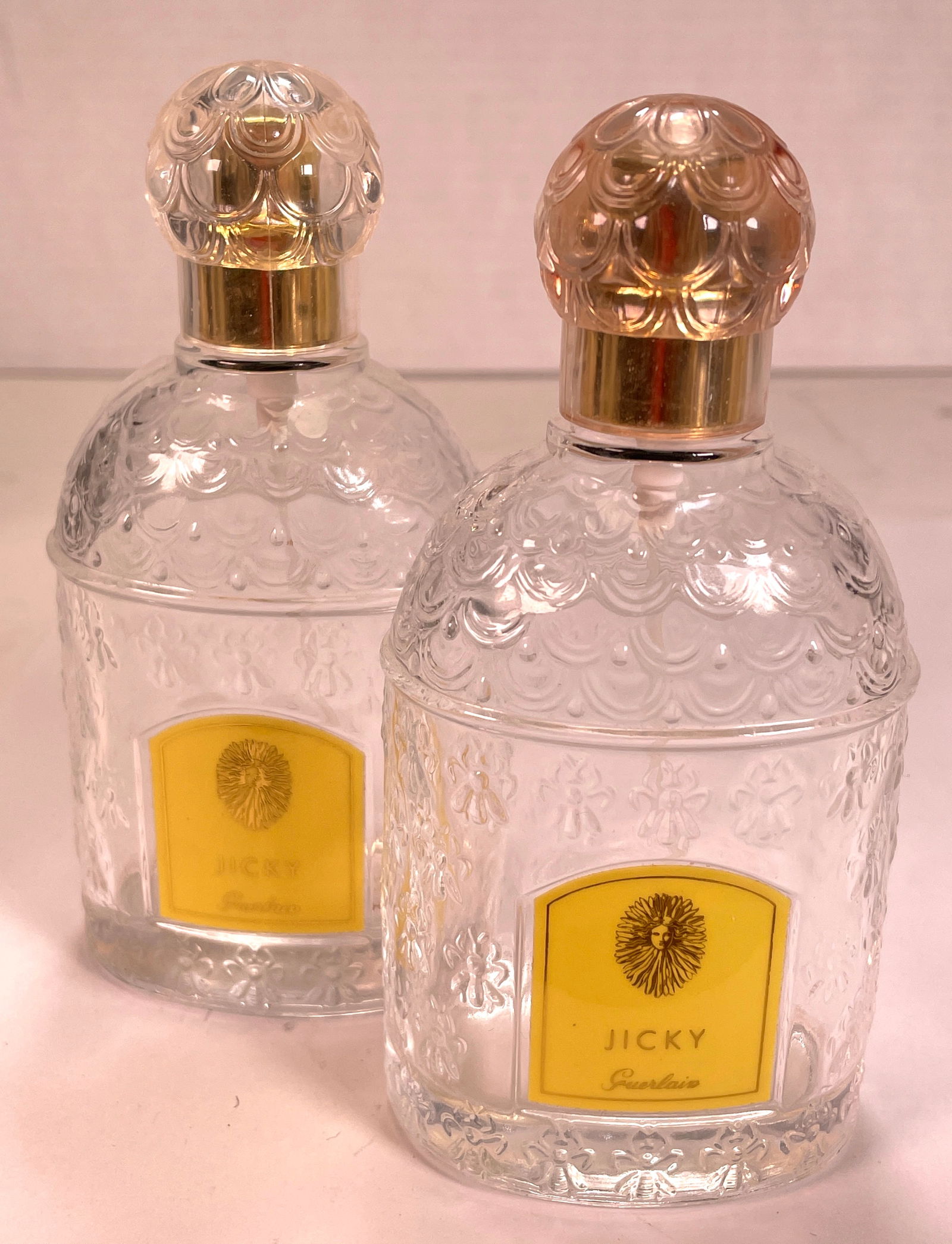 (2) Vintage Guerlain Jicky Eau De Parfum 3.3 Fl Oz: Two Vintage Guerlain Jicky Eau De Parfum 3.3 Fl Oz with Stopper Made in France , with original box. These are beautiful parfum bottles, they are all meticulously crafted with an embossed design. The J