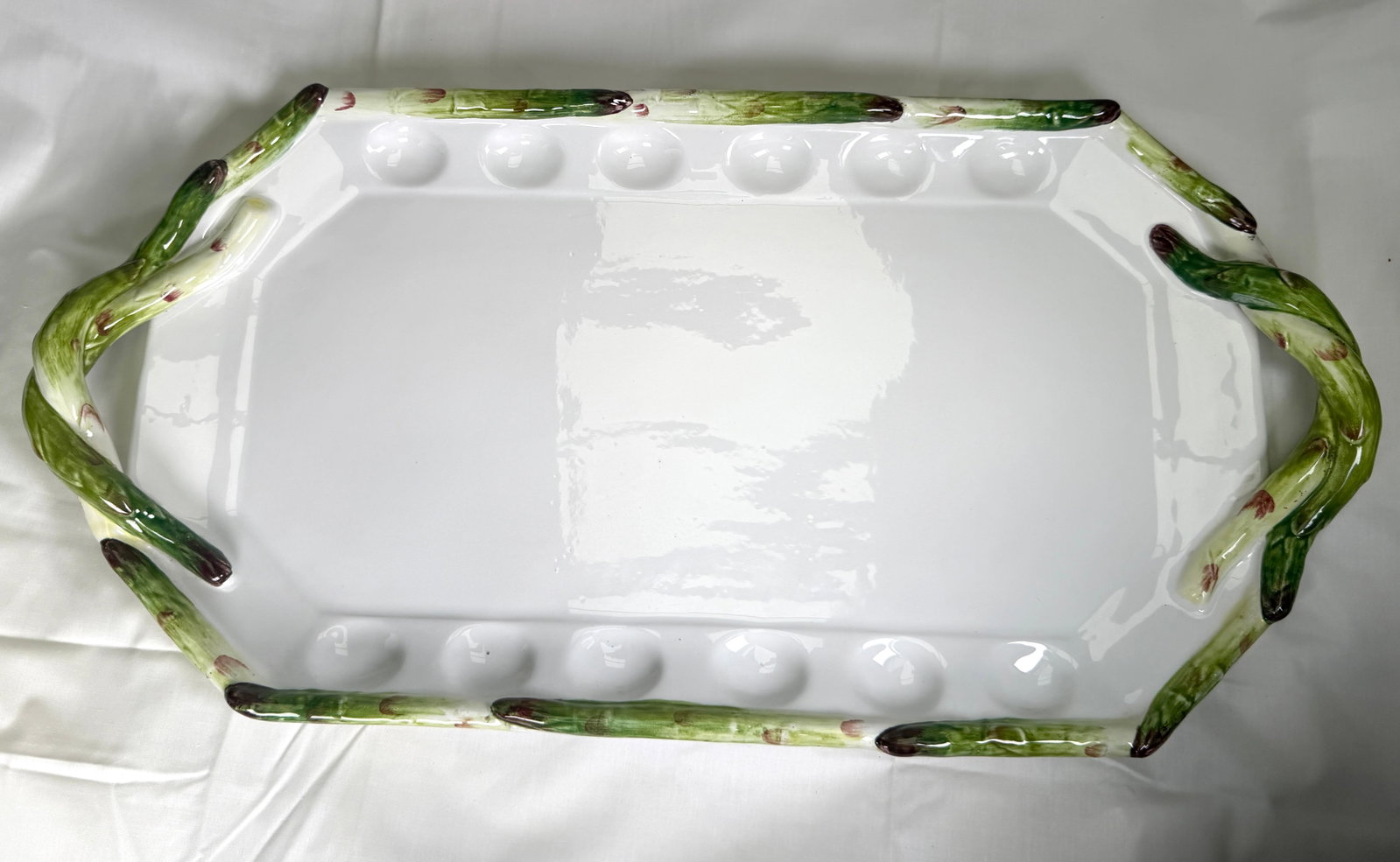 Vintage Costa Ceramic Majolica Platter Made in Italy No. 72226: This striking beautifully crafted piece was hand decorated in Italy. Designed with a playful asparagus motif around its scalloped edges, The center is a bright white with divets perfect for deviled eg