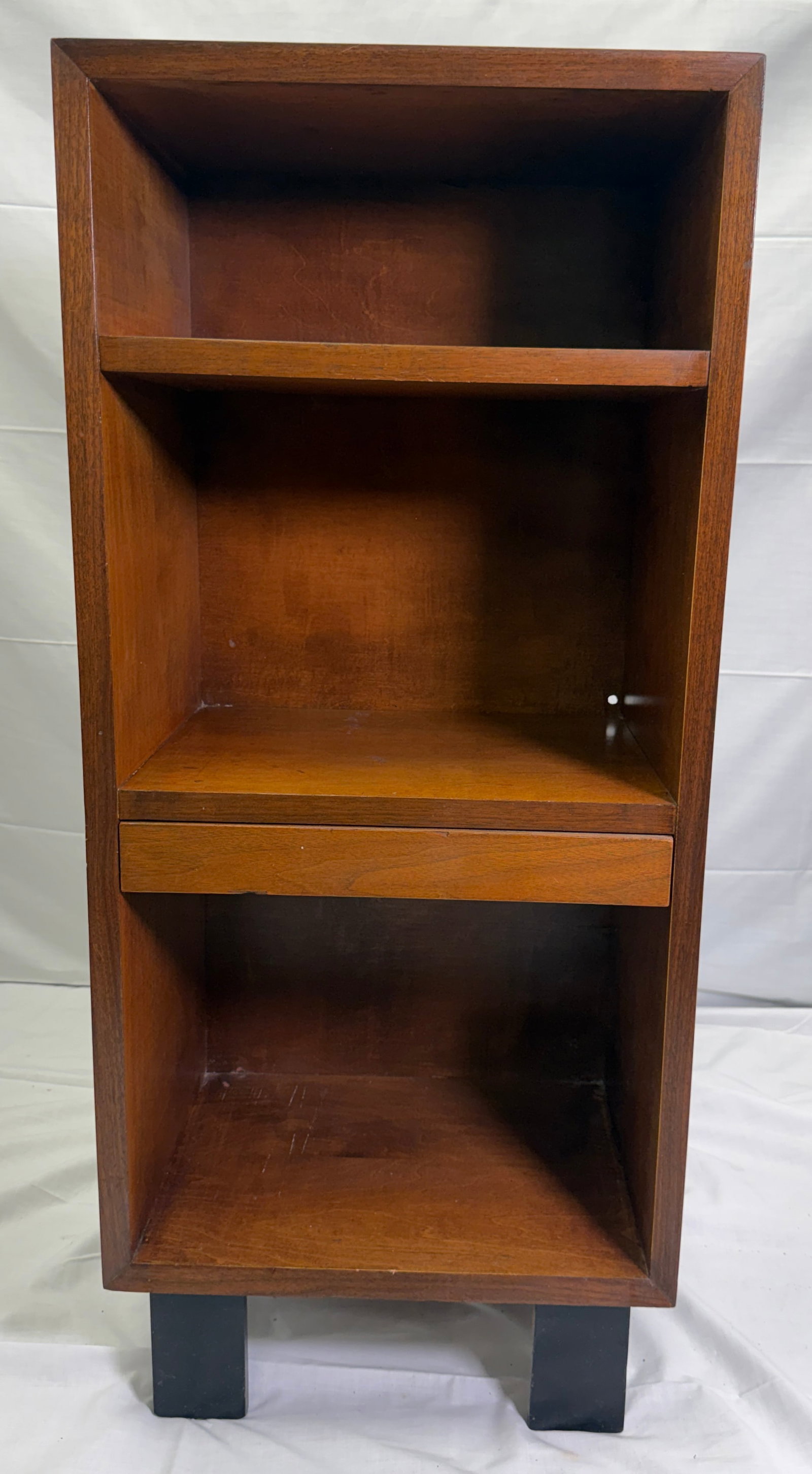 Walnut Nightstand by George Nelson for Herman Miller: A beautiful tall narrow nightstand, it is a sleek minialist design that features open shelving and a clever pull-out draw that can also serve as a flat surface for any of your needs. The entire piece 