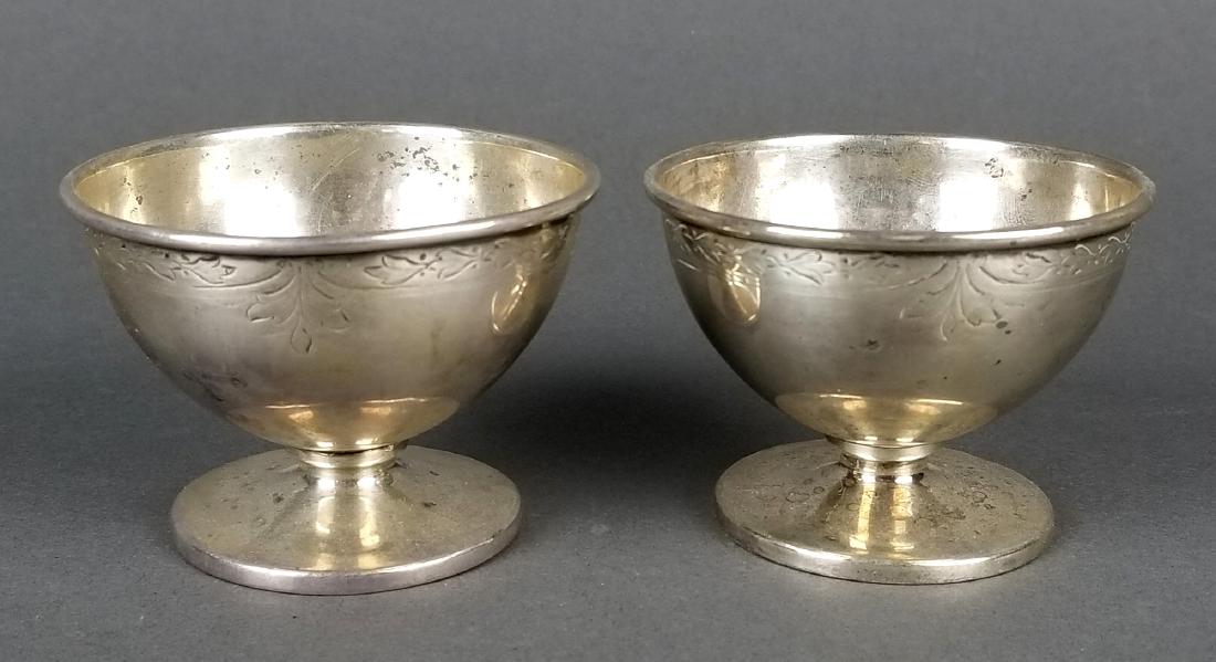 Pair of Sterling Silver Cups: Pair of Sterling Silver Cups. Measures H: 1 3/4" W: 2 1/2". Weight is 84 grams