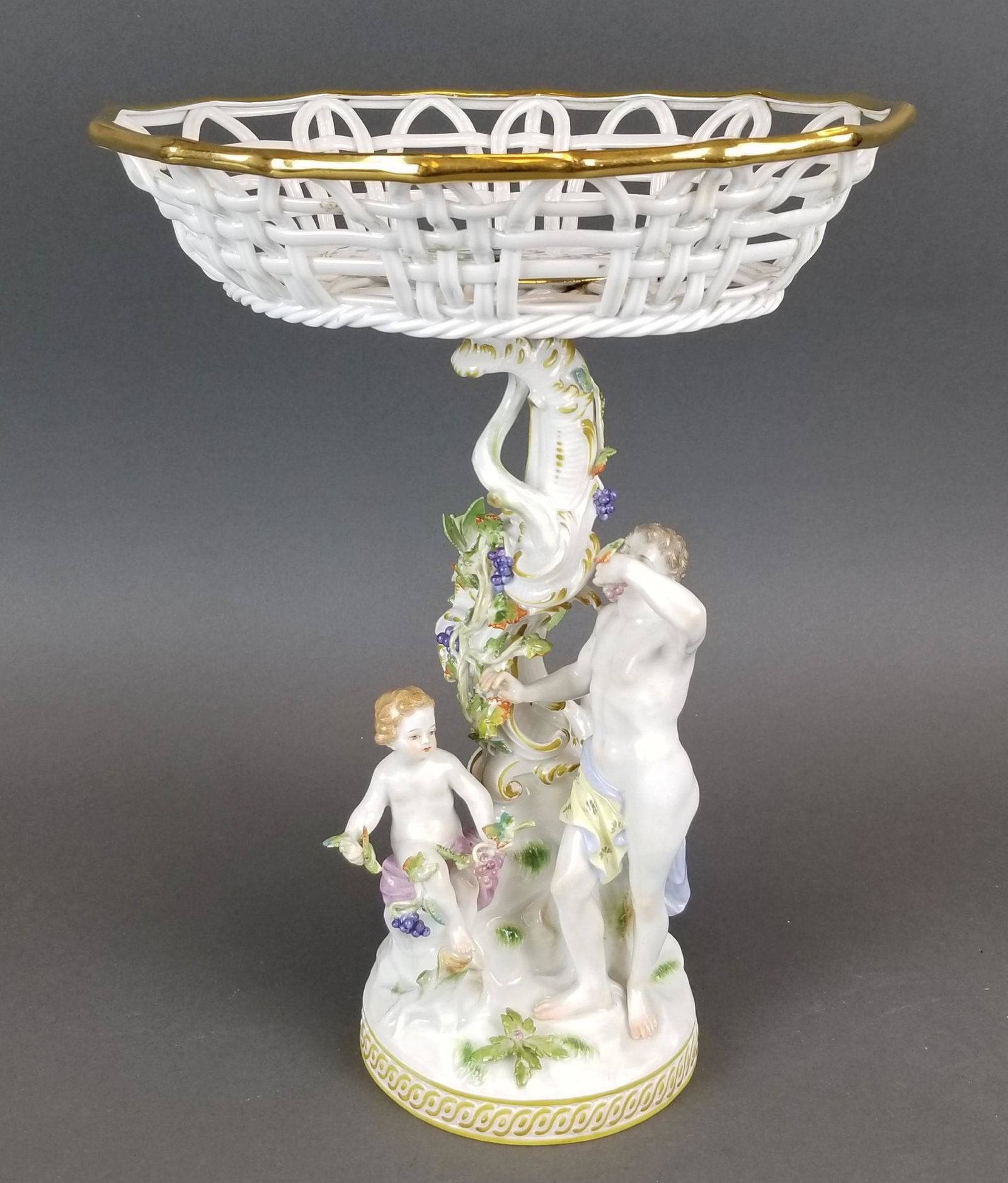 19th C. Meissen Porcelain Figural & Reticulated Cake: 19th C. Meissen Porcelain Figural & Reticulated Cake Stand. Measures H: 11 3/4" W: 9"