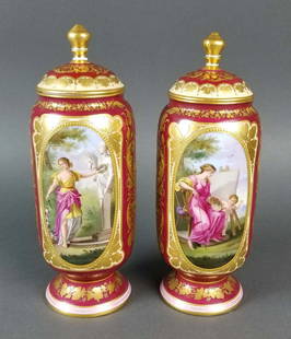 Pair of 19th C. Royal Vienna Hand painted Urns: Pair of 19th C. Royal Vienna Hand painted Urns. They measure H: 9" W: 3 1/4"