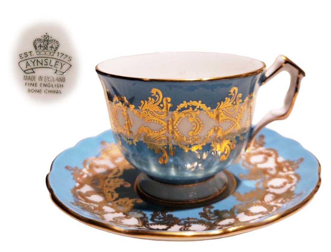 Aynsley Tea Cup And Saucer Fine English Bone China: Aynsley Tea Cup And Saucer Fine English Bone China. Made in England. Cup: H 3" x L 4" \ Saucer: D 5 1/2"