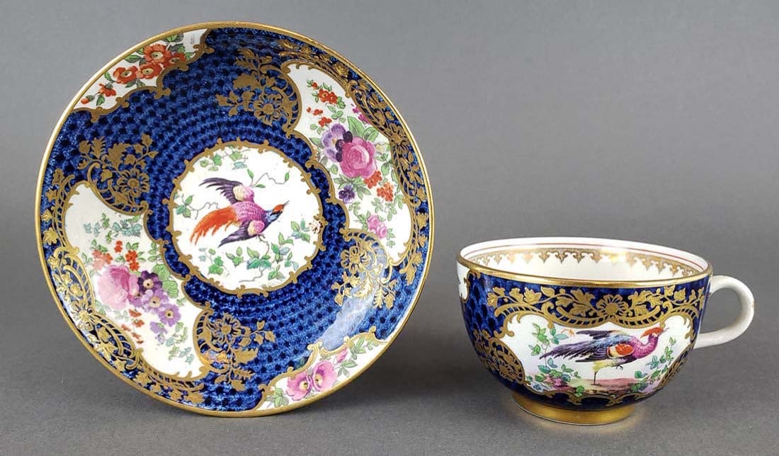 English Porcelain Cup and Saucer: English Porcelain Cup and Saucer. The cup measures H: 2 1/4" and the saucer measures 5 1/4" D