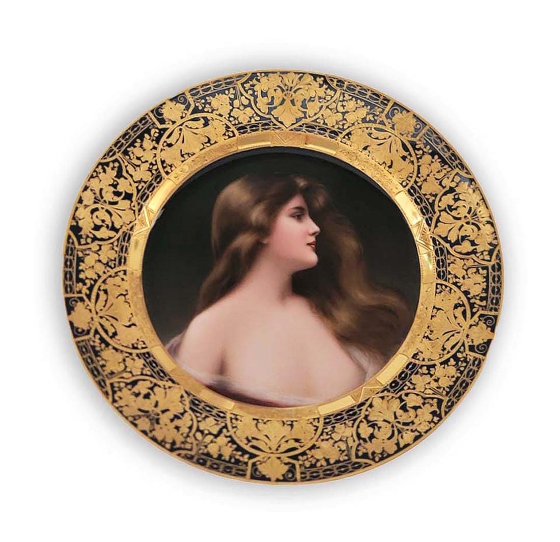 19th C. Hand Painted Royal Vienna Plate, Made In Germany: Hand painting of ' Odalisque ' with 24k Gold designing on boarder of the plate. Signed by ' Warner ' located on the middle right (by the hair). Beehive Vienna underglaze mark. 9 1/2" (Condition: Excel