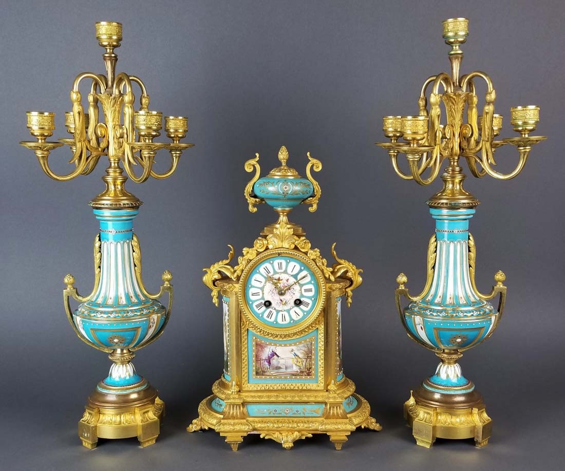 19th C. Sevres Turquoise Porcelain and Bronze 3 Pc.: 19th C. Sevres Turquoise Porcelain and Bronze 3 Pc. Clockset. The clock measures H: 14 3/4" W: 10 1/4" and the candelabras measures H: 10 1/4" W: 7"