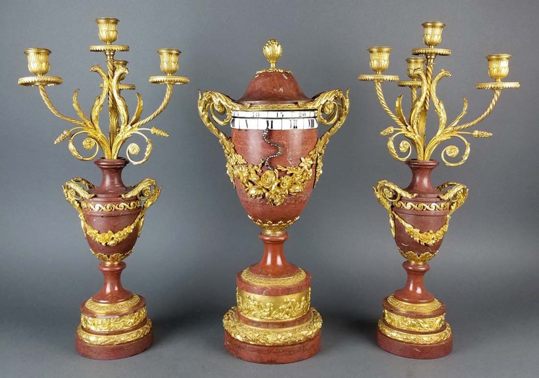 Fine 19th C. French Rouge Marge and Gilt Bronze Rotary: Fine 19th C. French Rouge Marge and Gilt Bronze Rotary 3 Pc. Clockset. The clock measures H: 18 1/4" W: 9" and the candelabras measure H: 19 1/4" W: 8 3/4"