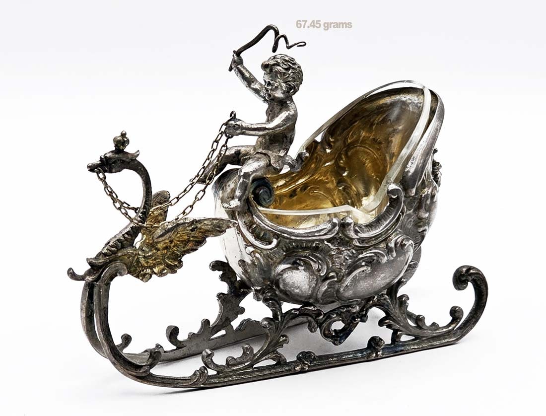 Silver Salt & Pepper Sleigh Cup With A Cherub: Silver Salt & Pepper Sleigh Cup With A Cherub. H 3" x W 1 1/2" x L 4"