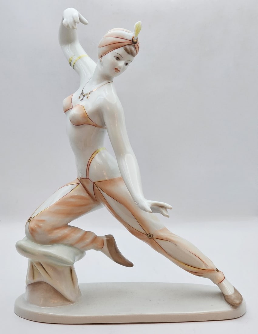 Vintage Hungarian Hollohaza Orientalist Dancer Figurine: Vintage circa 1960's Hungarian Hollohaza Hand-painted Porcelain Statue. Note: The stamp under the statue has been erased over time. Dimensions: 10" x 7.1/2" x 6"