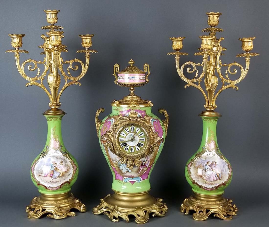 19th C. Sevres Porcelain and Bronze 3 Pc. Clockset: 19th C. Sevres Porcelain and Bronze 3 Pc. Clockset. The clock measures H: 17 3/4" W: 8 1/2" and the candelabras measure H: 22 3/4" W: 10"