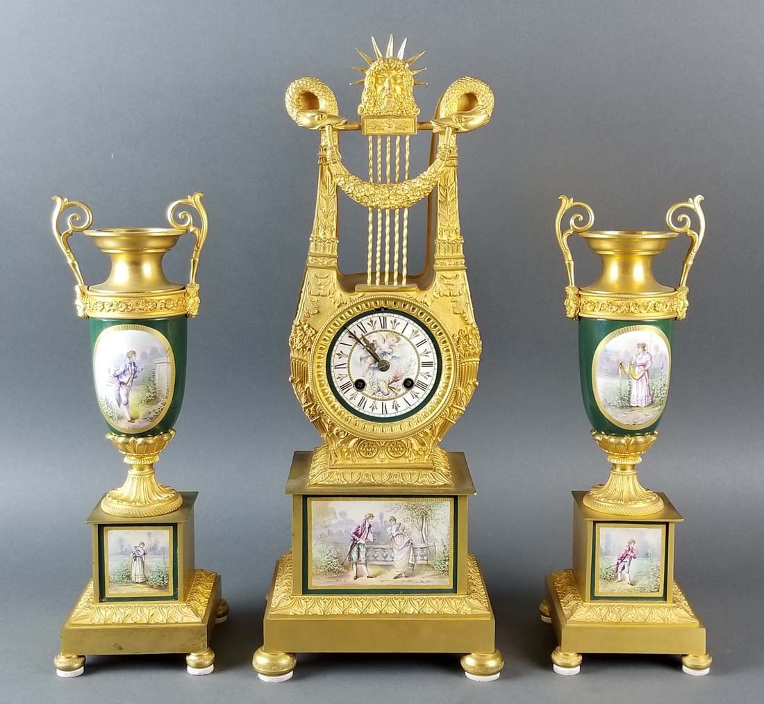 19th C. French Sevres and Bronze Clockset: 19th C. French Sevres and Bronze Clockset. The clock measures H: 18 3/4" W; 7 1/4" an the Vases measure H: 14" W: 4 3/4"