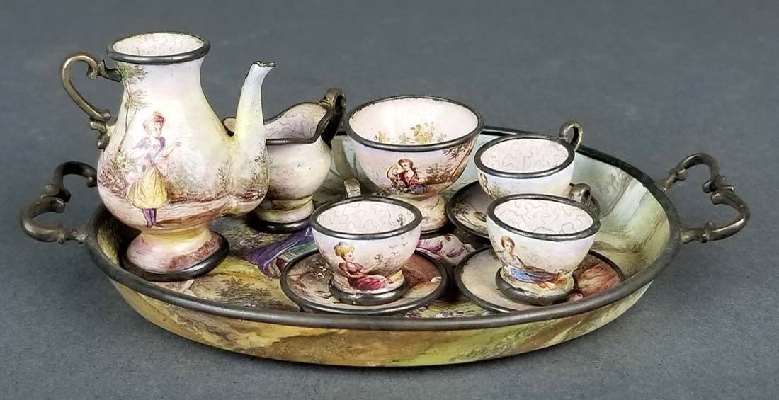 Austrian Viennese Enamel on Silver Teaset, 19th C.: Austrian Viennese Enamel on Silver Teaset, 19th C.. The tray measures 4 3/4" x 3 1/4" and the rest of the pieces range from H: 3/4" to H: 1 3/4"