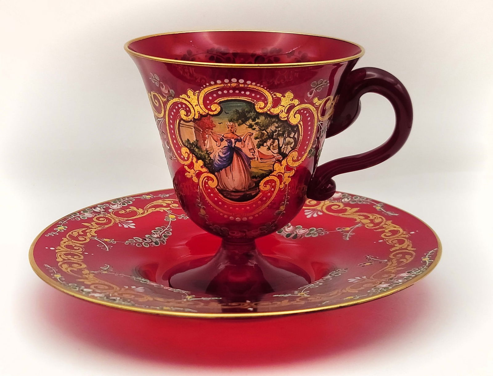 Bohemian Ruby Red Hand Painted Cup & Saucer: Bohemian Ruby Red Hand Painted Cup & Saucer. Cup: H 3 7/8" x W 3 1/2" x L 3 4 1/2" \ Saucer: D 6 1/2"