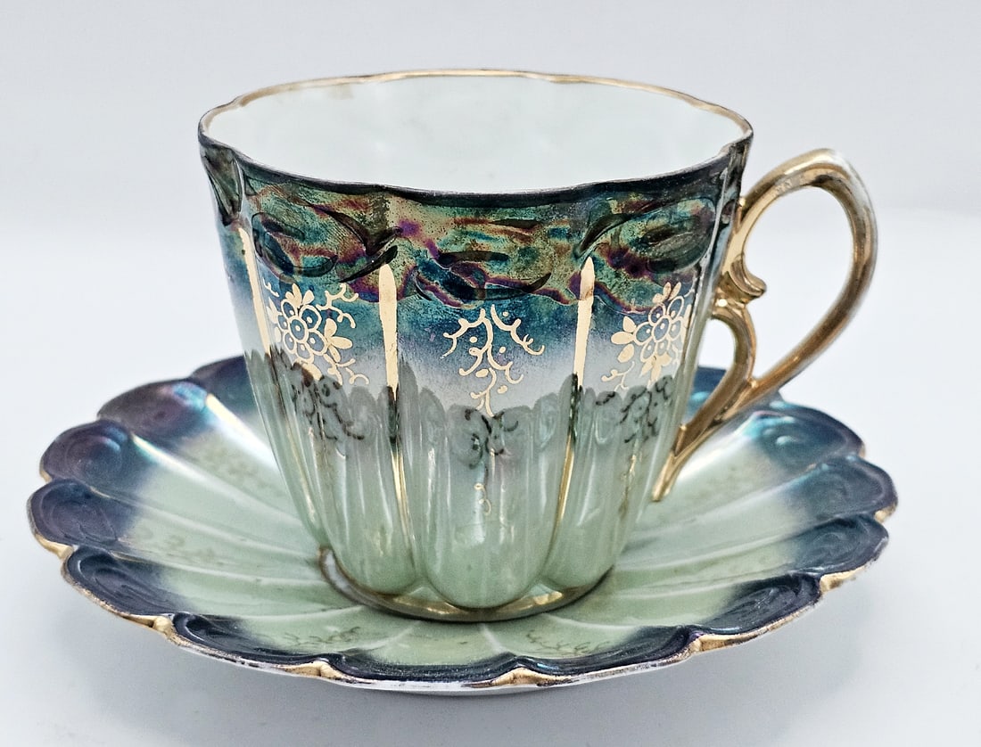 19th C. French Cup & Saucer: 19th C. French Cup & Saucer. Cup: H 3 1/2" x W 3 7/8" x L 4 1/2" \ Saucer: D 6 1/4"