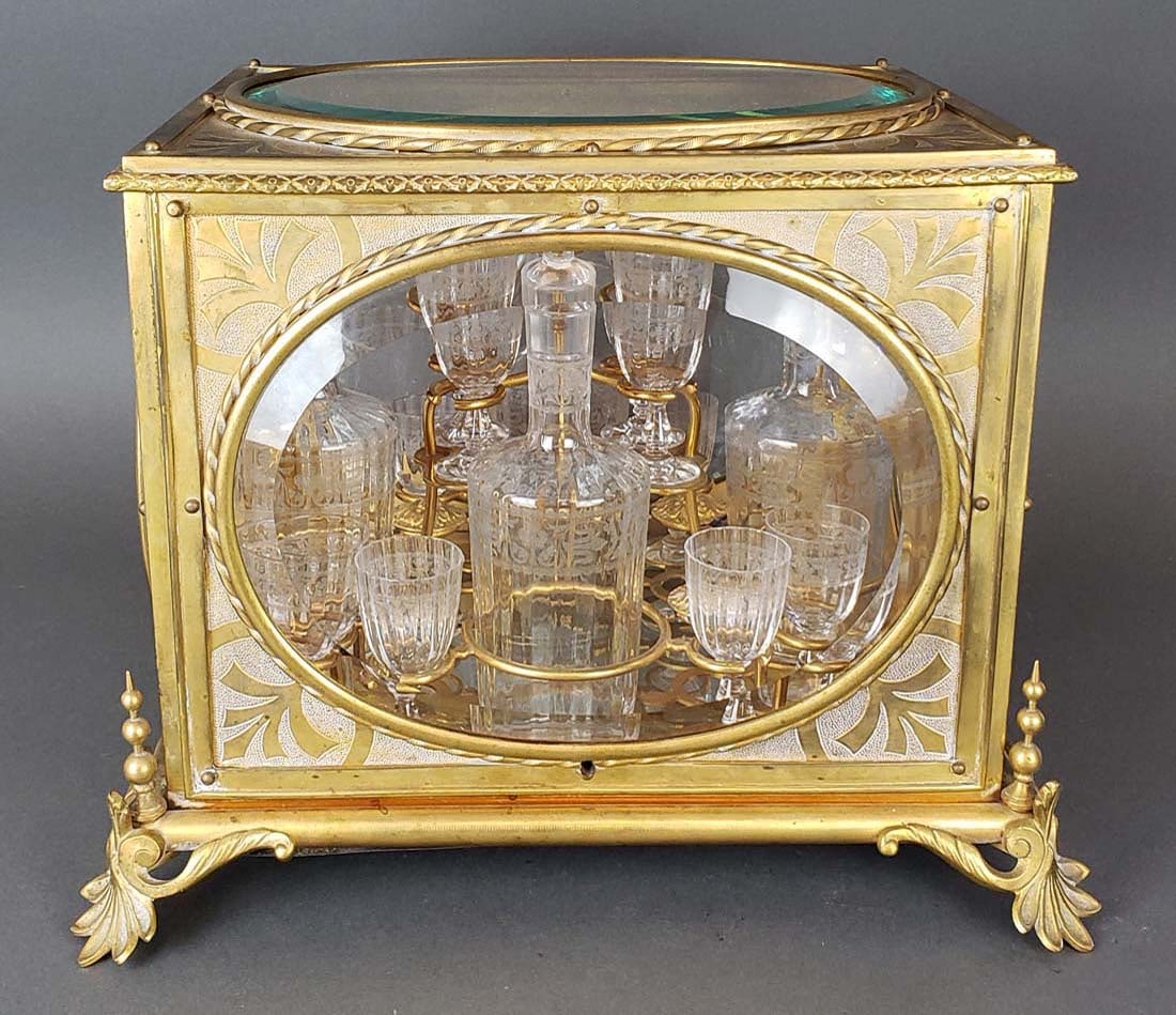 19th C. French Bronze & Baccarat Crystal Tantalus Set: 19th C. French Bronze & Baccarat Crystal Tantalus Set. The case measures H: 11 1/4" W: 12" , the 4 bottles measures H: 8 1/4" and the 12 glasses measure H: 3"