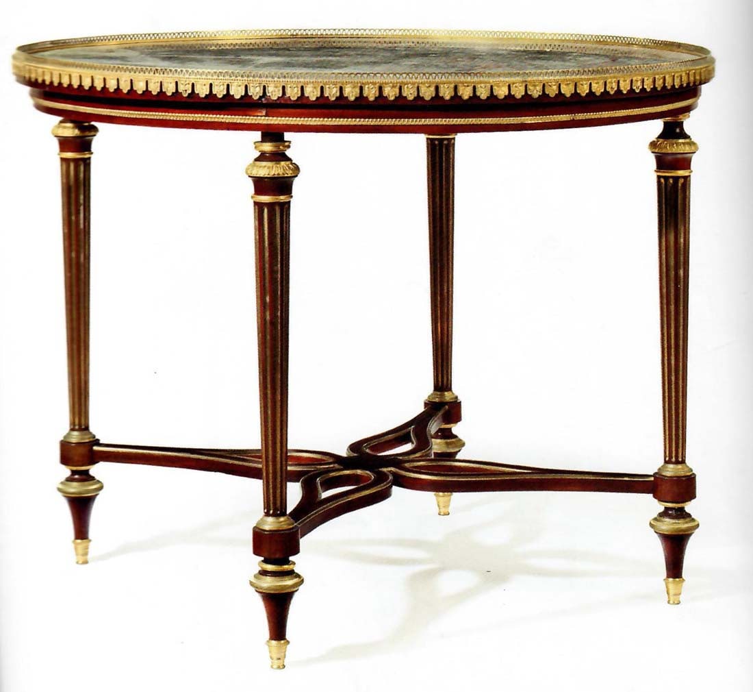 A French Ormolu Mounted Mahogany Gueridon by Henry: A French ormolu Mounted Mahogany Gueridon by Henry Dasson, Paris, Dated 1885. Measures H: 29 1/2" D: 38 1/2"